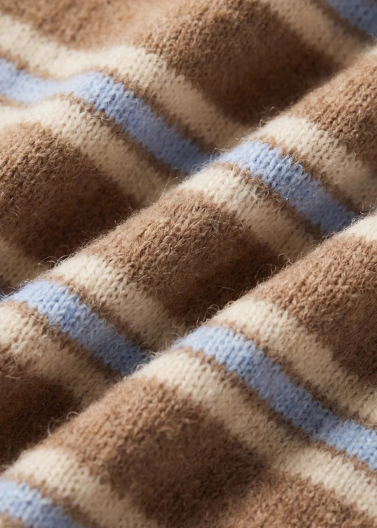 Close-up of a soft knit fabric with horizontal stripes in brown, cream, and light blue, showing the texture and weave detail.