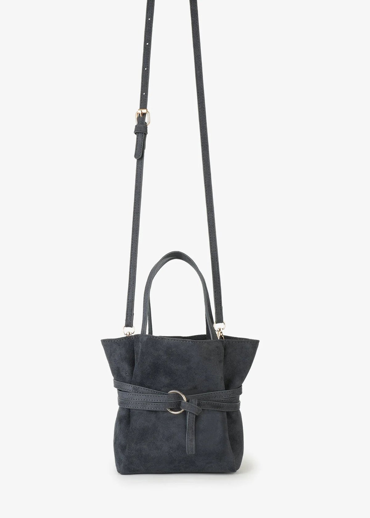 A dark charcoal gray suede crossbody bag with a matching top handle and a wide front belt featuring a silver-tone ring buckle, shown against a plain white background.