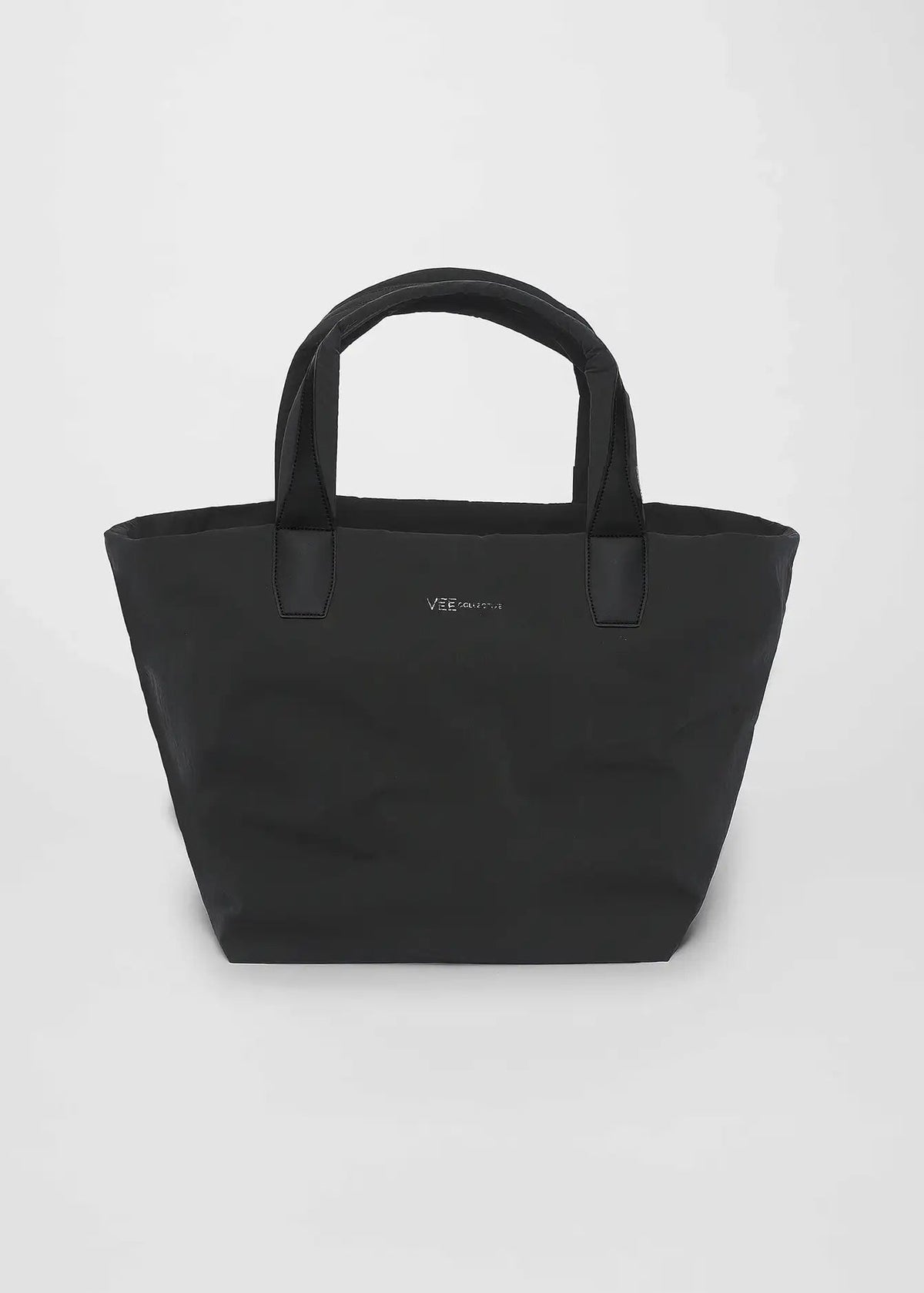 Black tote bag on a light gray background
