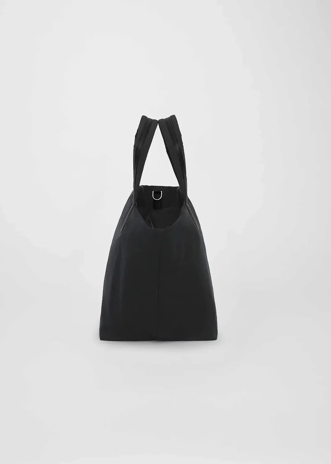 Black tote bag on a light gray background