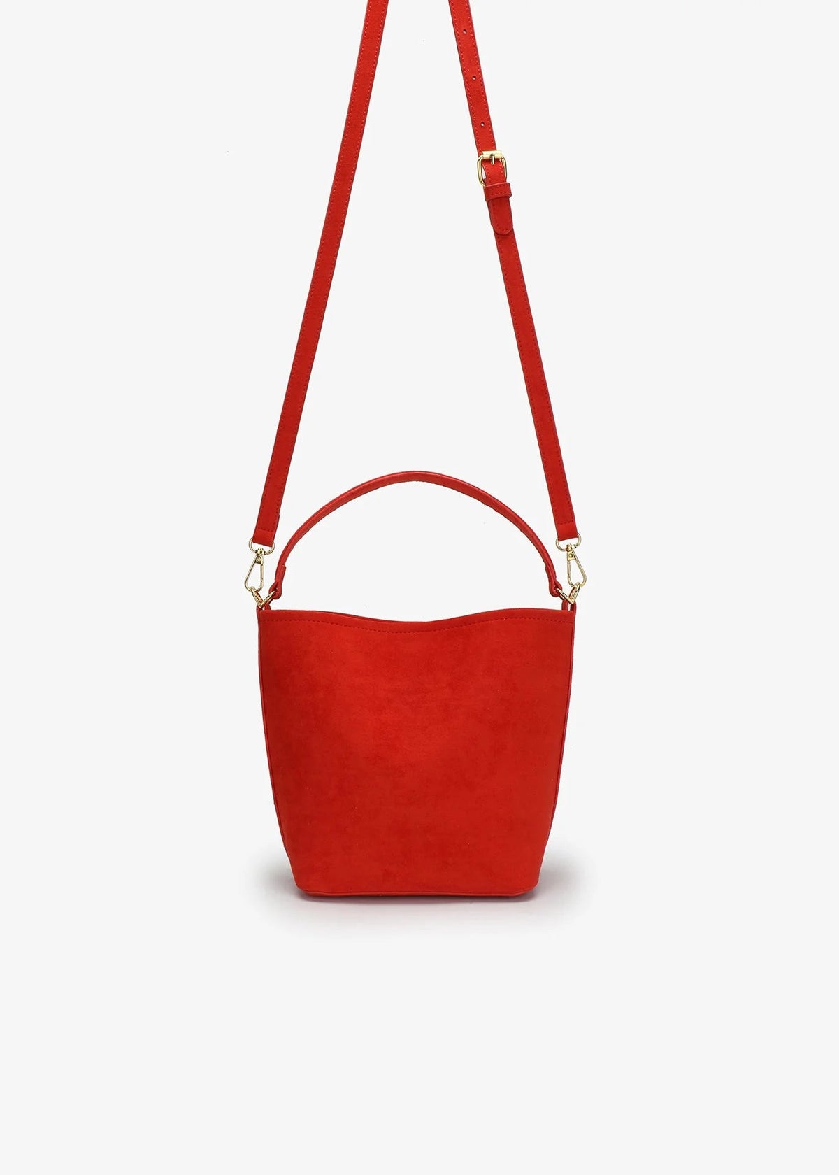 A bright red bucket-style handbag with a top handle and a matching shoulder strap, shown against a plain light gray background.