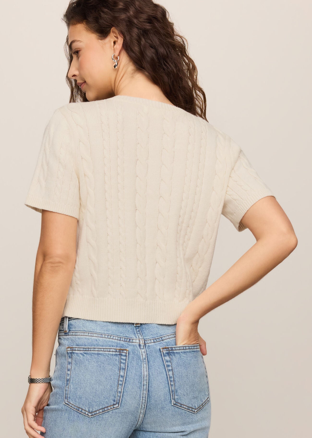 Woman in white short sleeve shirt